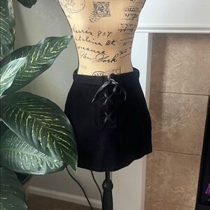 NWT So Elevate your style with this chic black high rise mini skirt.This